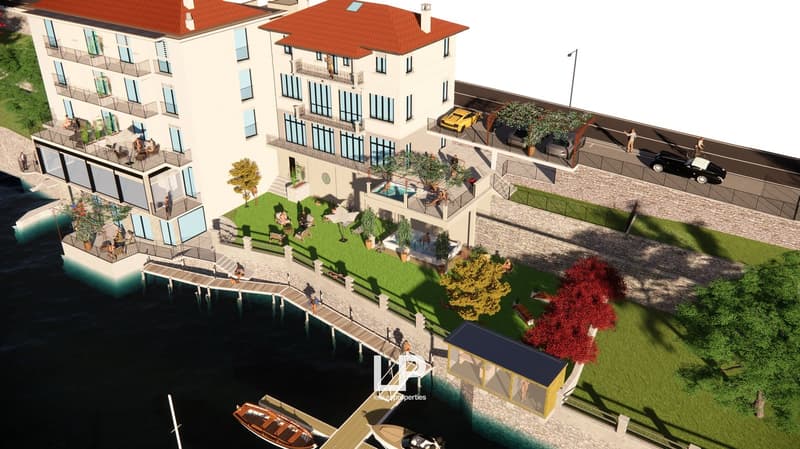 multi-story building, balcony, swimming pool, green lawn, view of water