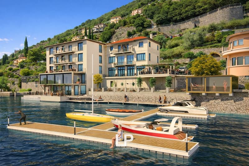 Luxury building overlooking a bay, multiple terraces, multiple boats docked