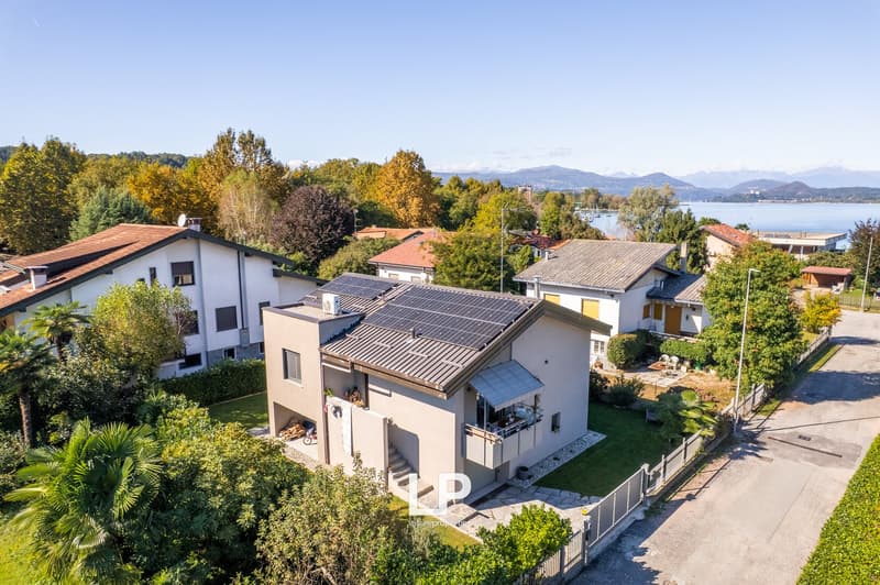 Detached house, solar panels, landscaped garden, terrace, view