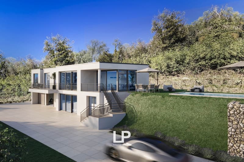 Two-story modern house with large windows, balcony, garage, and swimming pool surrounded by lush greenery and trees