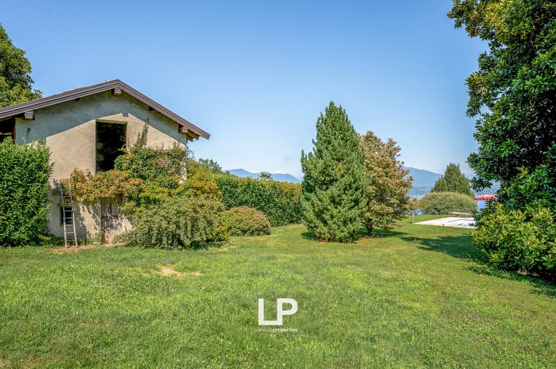 house, swimming pool, large grass area, bushes, view