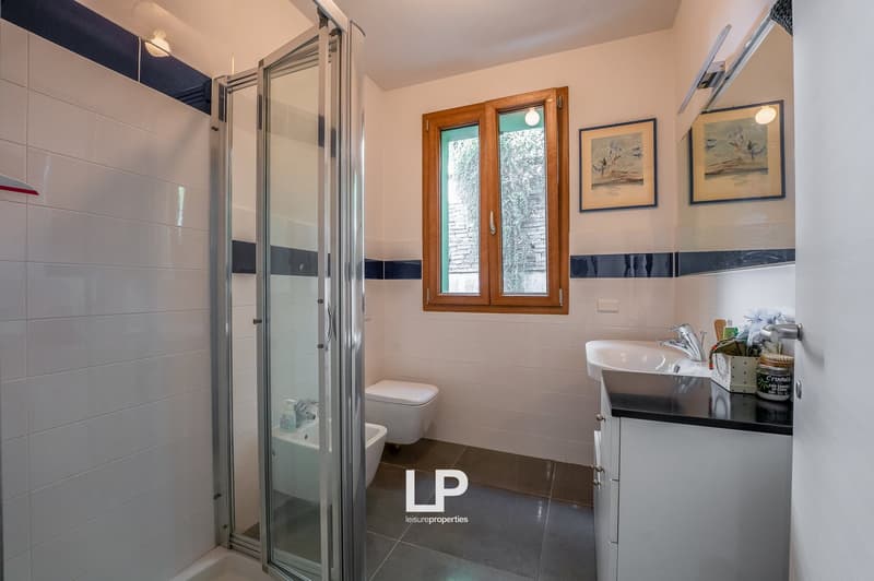 modern bathroom, walk-in shower, bathtub, toilet, sink, wooden window