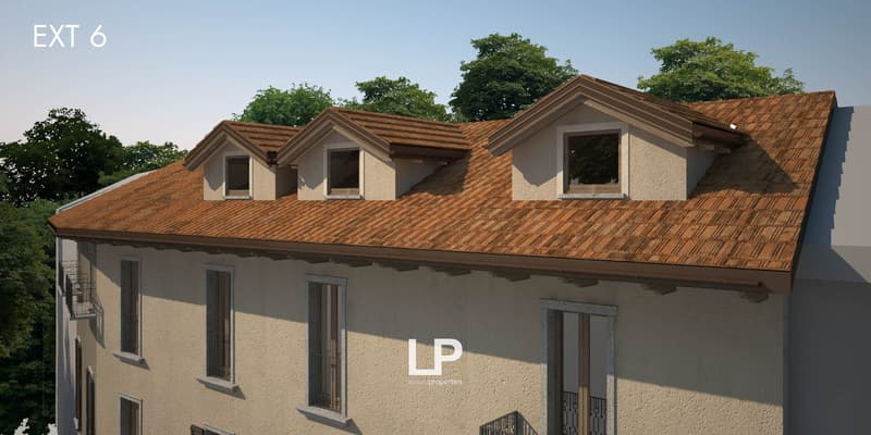 Facade with several windows, roof made of brown tiles