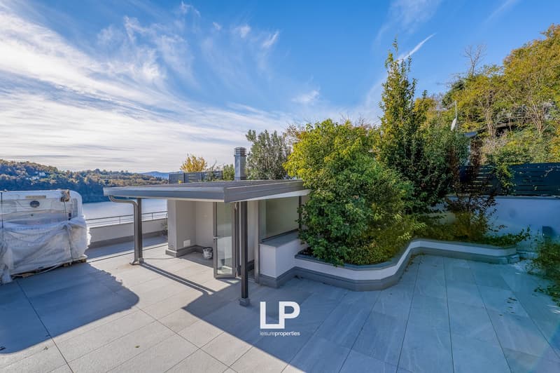 covered outdoor terrace with a pool, jacuzzi, and garden area