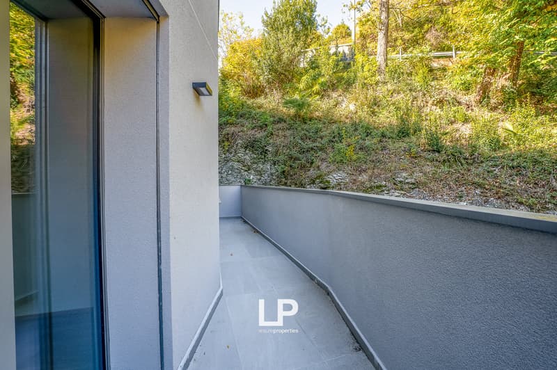 Balcony, large window, outdoor wall, tiled floor, light fixture