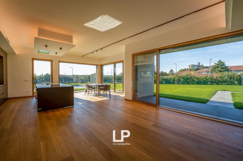 Modern house, kitchen and living area with large windows, wooden floor, open plan, exterior views