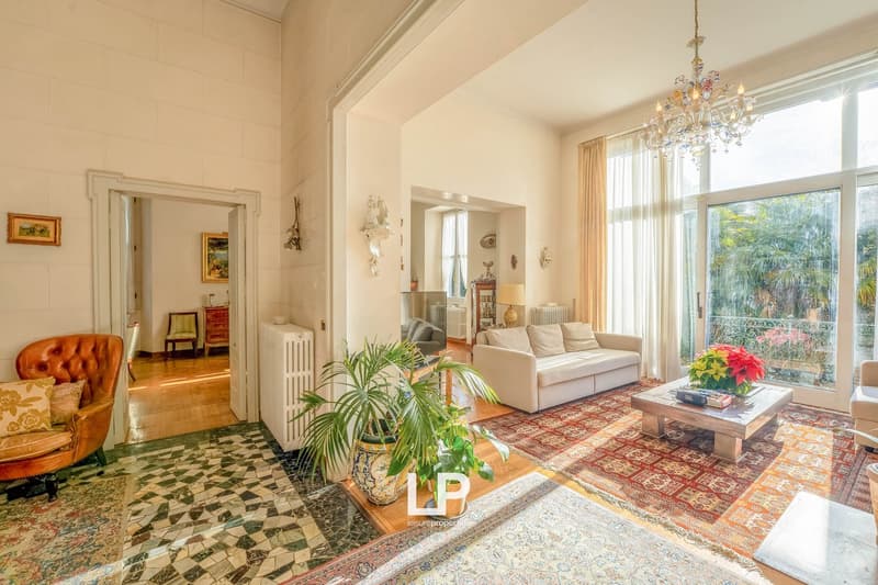 chandelier, carpet, balcony with view, windows, armchair, couch, coffee table with flowers