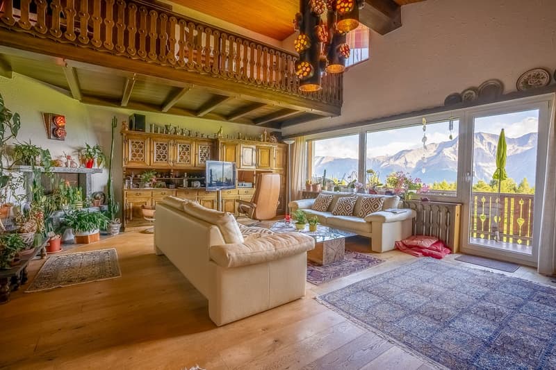 open-plan living and dining room with fireplace, balconies, glass windows with balcony railing, floor-to-ceiling windows, large glass windows, glass doors, couch, glass coffee table, rug, cabinet, TV