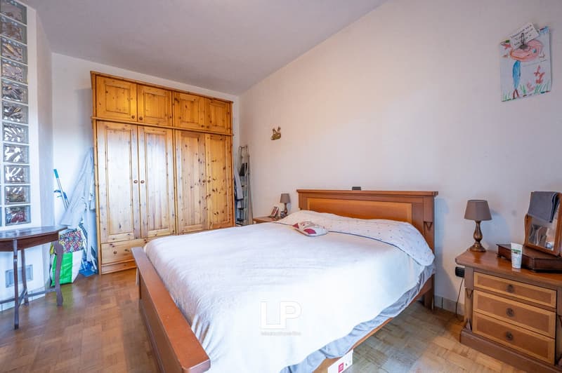 double bed, bedside table, large wooden wardrobe, night lamp, nightstand