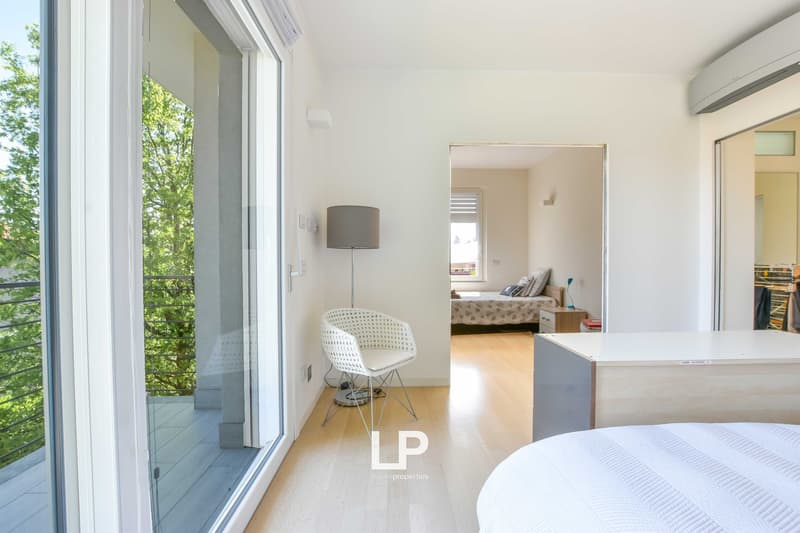 minimalist room, large windows, balcony, chair, desk, bed