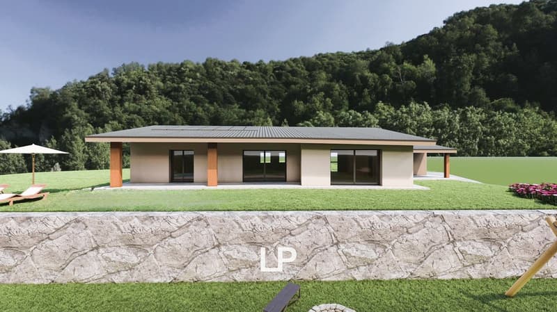 House with two glass doors, stone wall with lounge chairs, grassy area, solar panels on the roof