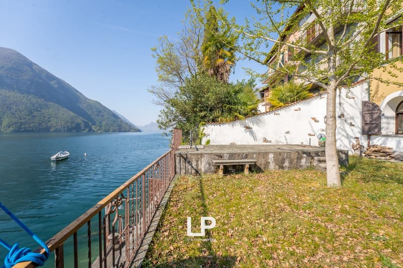 House with lake view, balcony, garden, boat in the lake