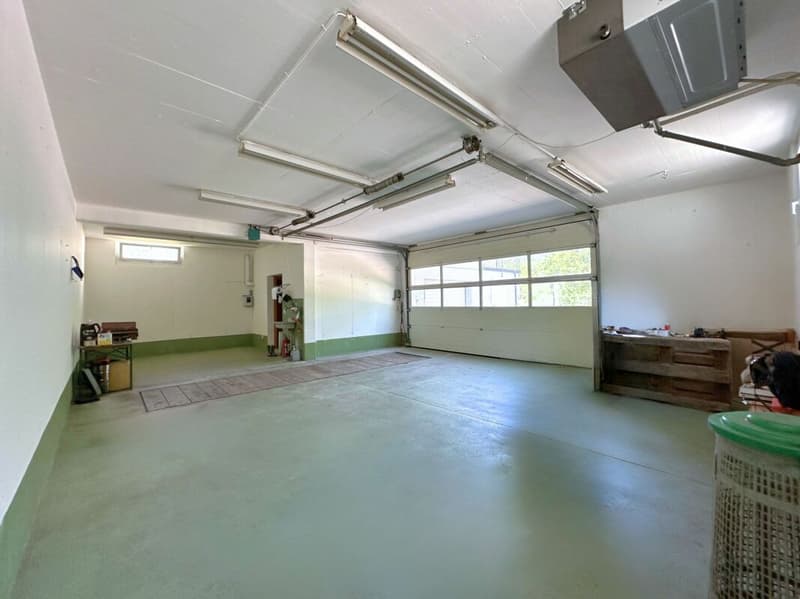 Interessante casa unifamiliare nel verde, con grande locale hobby/garage e parziale vista lago (15)