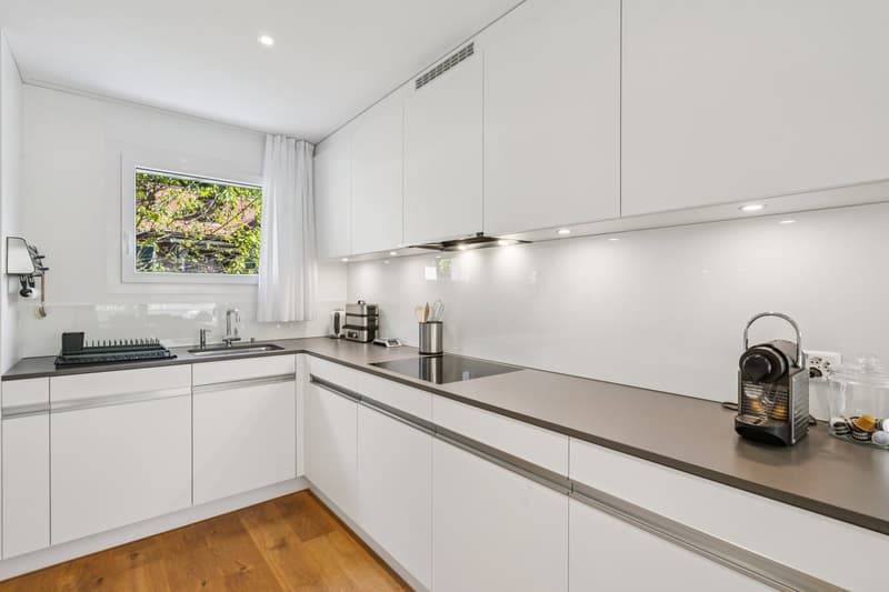 kitchen with white cabinets, gray countertops, gas stove, dishwasher, window, sink, faucet, kitchen appliances, and a coffee machine