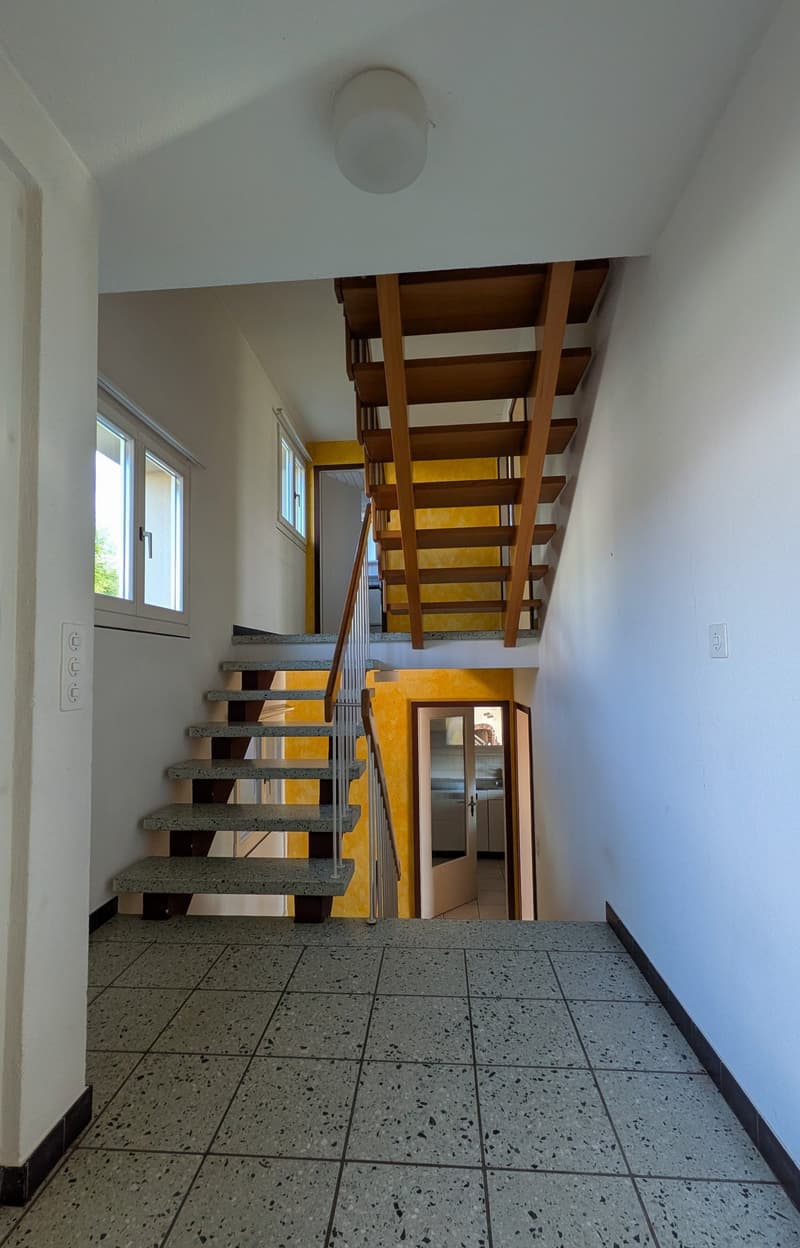 staircase, yellow wall, white walls, windows, tiled floor