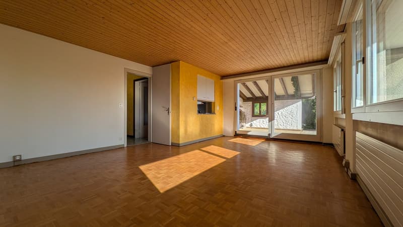 empty room, wooden floor, sliding glass doors, yellow wall, white ceiling, white walls