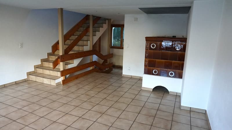 tiled floor, wooden staircase, decorative fireplace, windows, power outlets