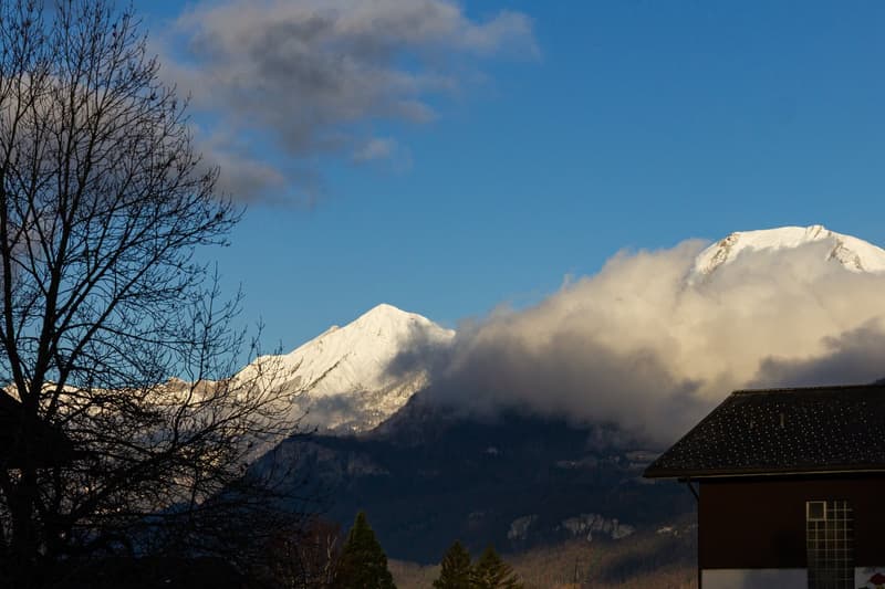 House with a view of a snowy mountain range