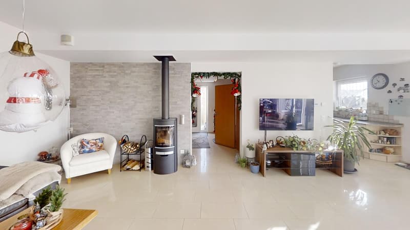 living room with white walls, beige tiles, fireplace, tv, furniture