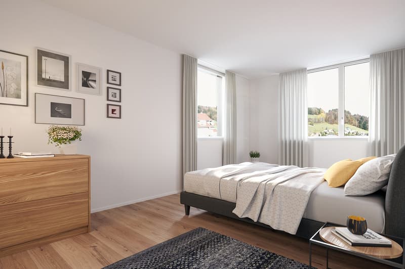 Modern interior with wooden floor, white walls, large windows with view of hills
