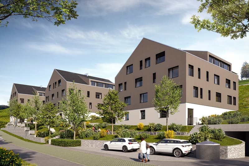 Modern apartment building with 3 floors, brown exterior, white windows, balconies, parking area, landscaped garden, and a sloped terrain