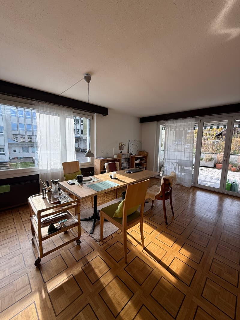 dining room with table, chairs, buffet, large windows, outdoor access