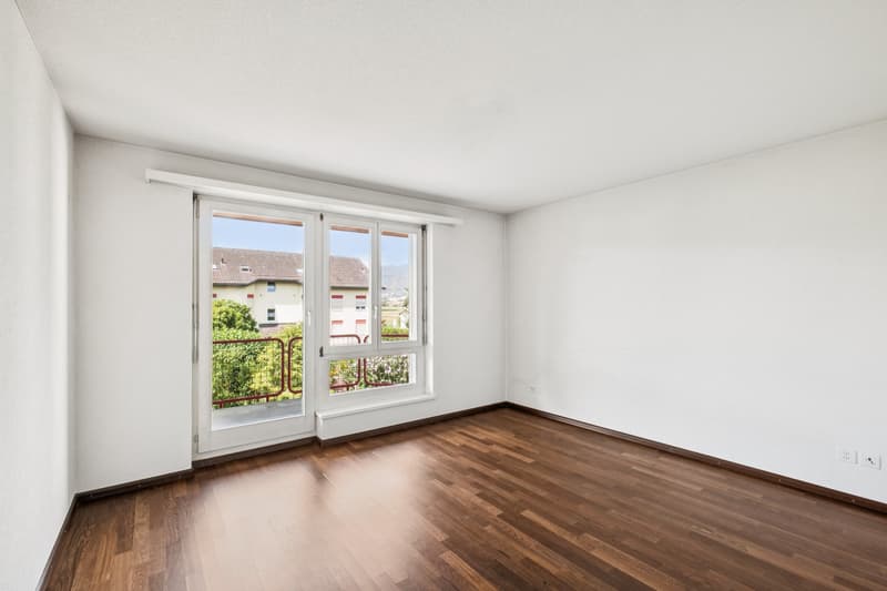 Schlafzimmer mit Zugang zum Balkon