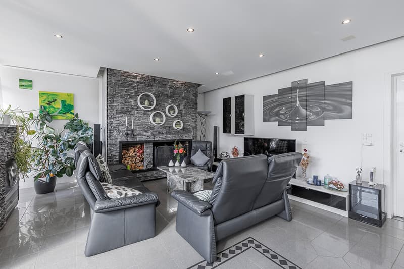 Wohnzimmer mit stilvollem Cheminée