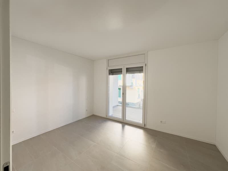 empty room, white walls, tiled floor, sliding glass door, balcony