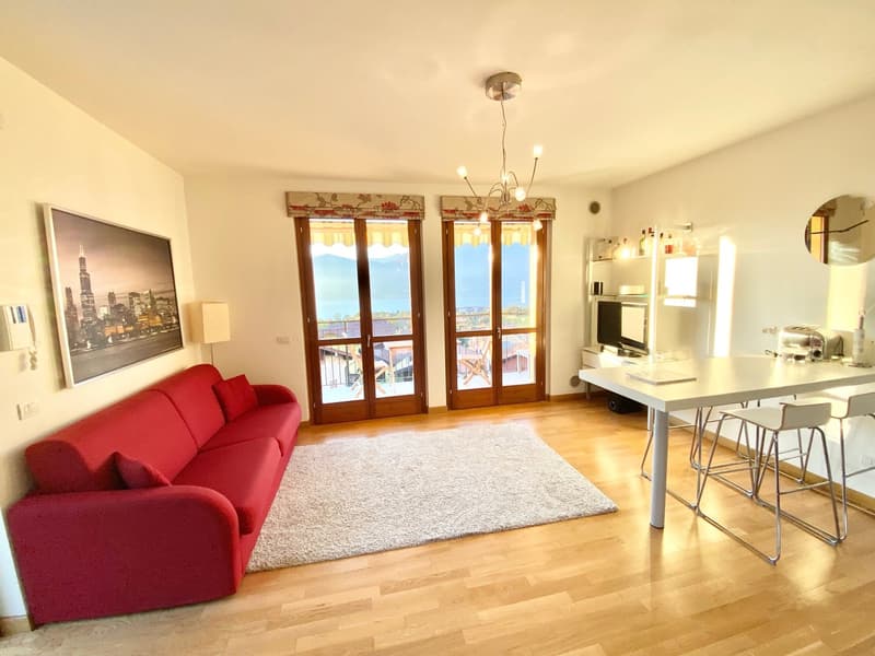 Très beau 2-pièces appartement d'angle avec terrasse et piscine chauffée au solaire avec vue imprenable sur le lac (4)