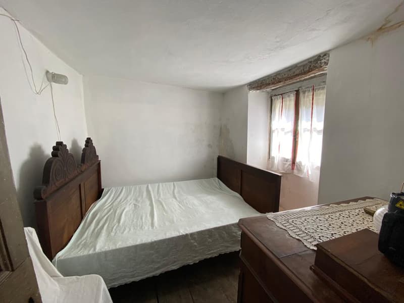 white bed, wooden headboard, wooden bed frame, white sheet, wooden desk, lace table runner, white curtain