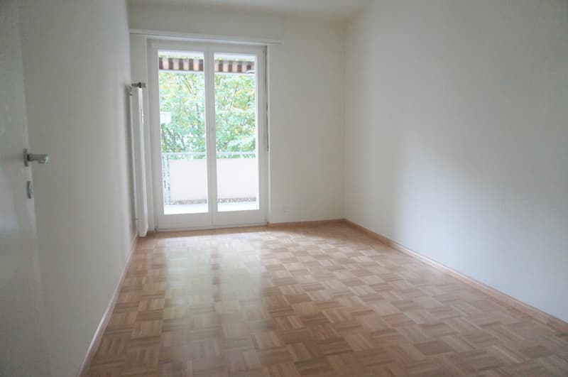 empty room, hardwood floors, white walls, sliding glass door, balcony