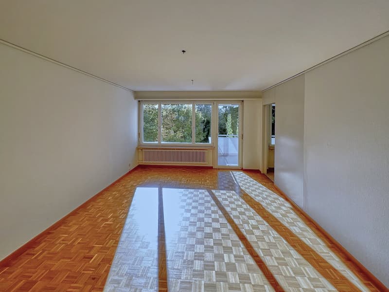 empty room, wooden floor, white walls, large windows, balcony
