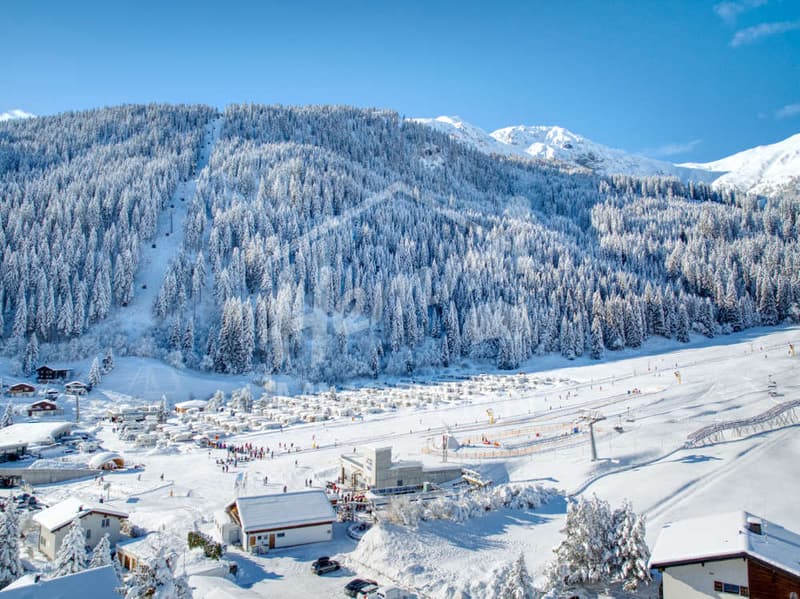 snowy mountains, ski slopes, ski lift, ski resort buildings, people skiing