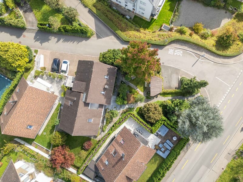 Aerial view, Multiple houses, driveways, 2 parking places, street