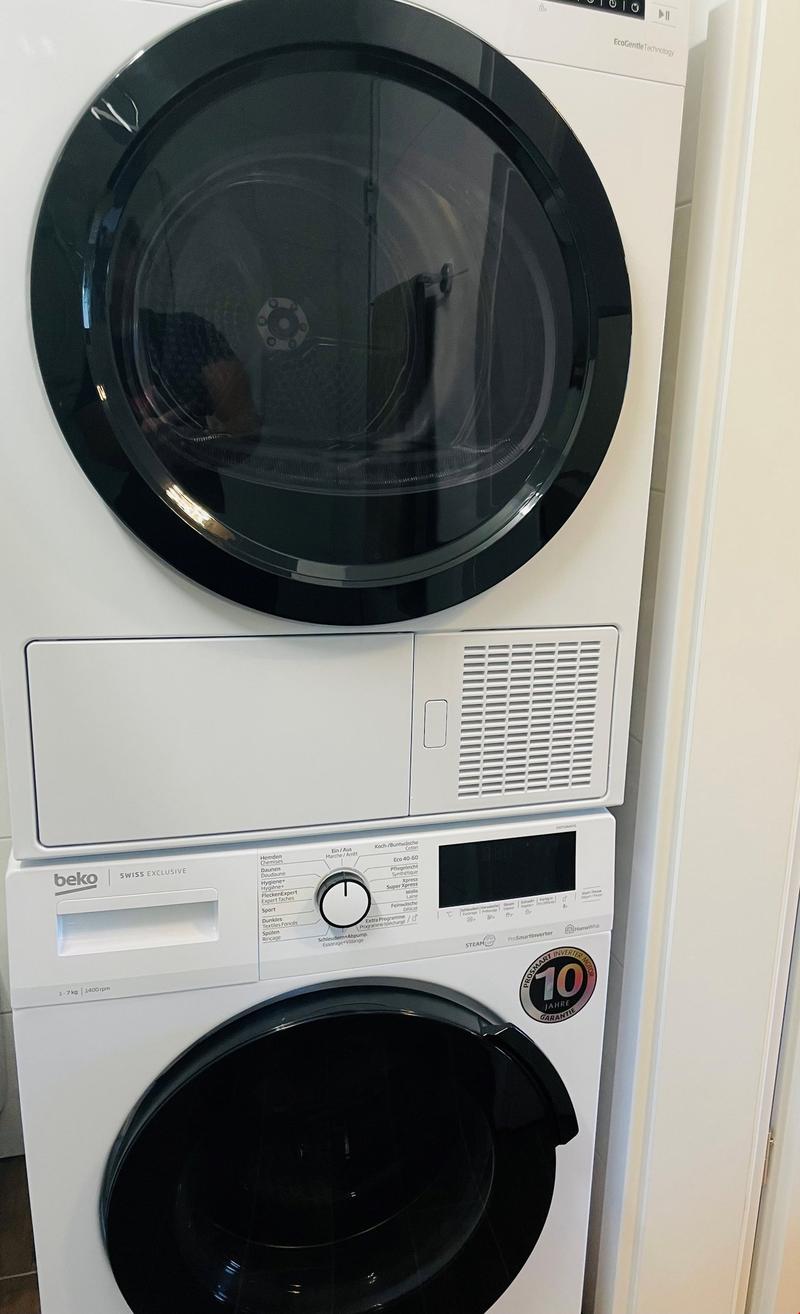 Stacked white washing machine and dishwasher, BEKO brand, modern design, full-size