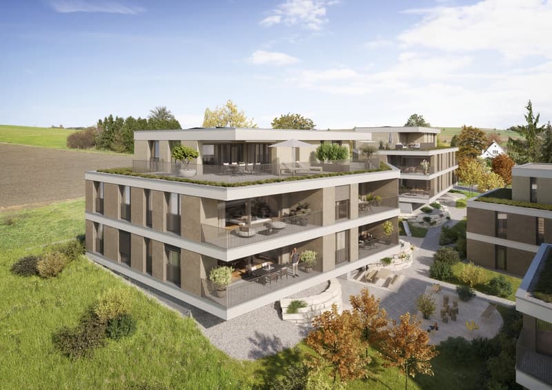 Modern design building with multiple floors, green roofs, several balconies, raised ground floor, central courtyard, parking area