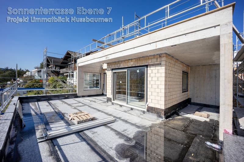 Under construction, brick exterior, glass doors and windows, flat roof