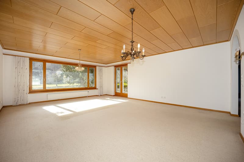 empty room, wooden ceiling, carpet, windows, chandelier, hallway