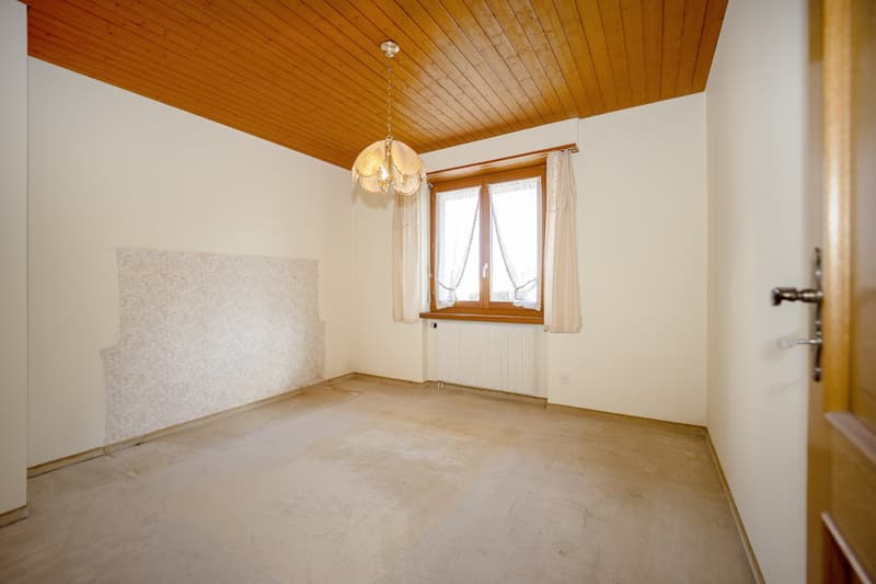 Empty room with wooden ceiling, windows, white walls, floor