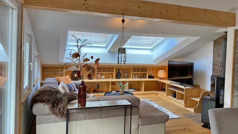 double ceiling, large windows, flat screen TV, fireplace, sofa, wooden shelves, decorative items
