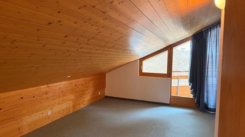 empty room, wooden walls, carpeted floor, window with balcony