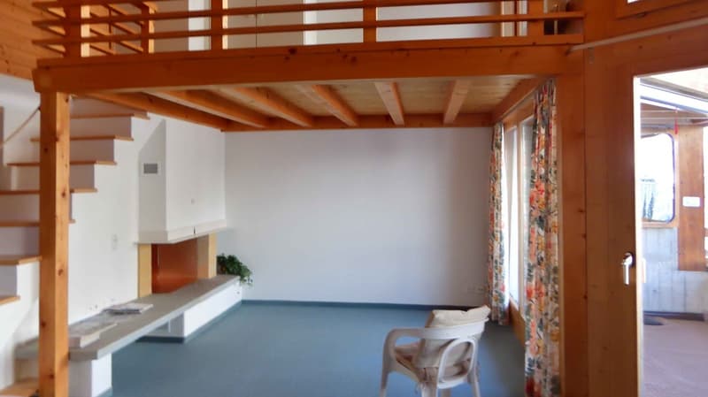 wooden ceiling, fireplace, white walls, blue floor, white chair, wooden stairs