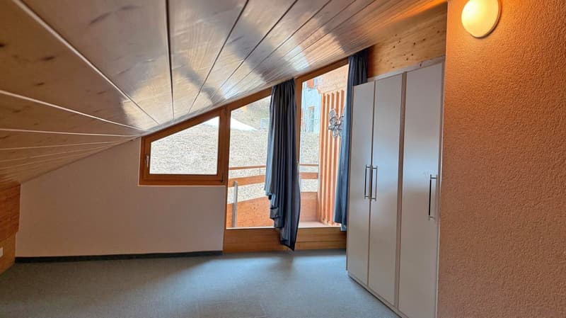 empty room, wooden ceiling, large window, balcony, wardrobe