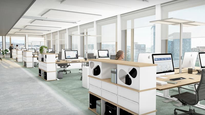 Spacious open-plan office with large windows offering a panoramic view of the city skyline. The office features modern workstations with computers, storage units, and ergonomic chairs. The overall design is minimalist and bright, creating a professional a