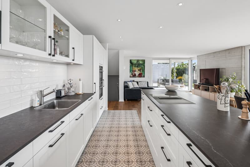 modern white cabinets, black countertops, white tiles, modern kitchen appliances, decorative elements