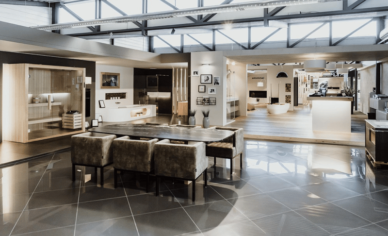 modern dining area with wooden table, modern grey chairs, exposed metal ceiling, high ceiling, large floor to ceiling windows