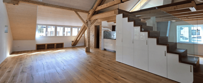 wooden floor, wooden beams, white wardrobes, glass staircase