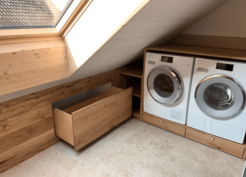 wooden wall, wooden floor, 2 washing machines, storage drawer