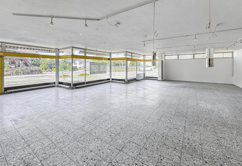 Empty room, white tiles, high ceiling, glass windows, ceiling lamps